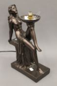 An Art Deco style figural lamp.