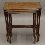 An Eastern carved hardwood nest of tables. Largest 59 cm wide, 29 cm deep, 63 cm high.