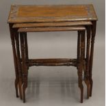 An Eastern carved hardwood nest of tables. Largest 59 cm wide, 29 cm deep, 63 cm high.