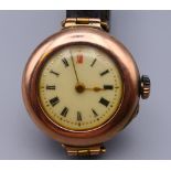A ladies 9 ct gold cased wristwatch. 3 cm wide. 20 grammes total weight.
