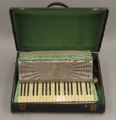 A boxed Settimio Soprani accordion. The box 57 cm wide.