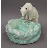 A Czechoslovakian pottery model of a polar bear. 21 cm wide.