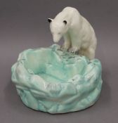 A Czechoslovakian pottery model of a polar bear. 21 cm wide.