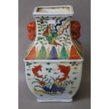 A Chinese porcelain vase decorated with fish. 36 cm high.