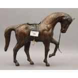 A leather model of a horse. 25.5 cm high.