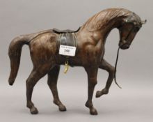 A leather model of a horse. 25.5 cm high.