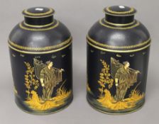 A pair of navy blue toleware tea tins. 37 cm high.