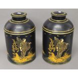 A pair of navy blue toleware tea tins. 37 cm high.