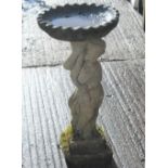 A bird bath. 82 cm high.