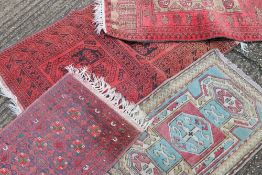 Four small rugs. The largest 135 x 78 cm.