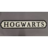 A 'Hogwarts' wooden sign. 78 cm long.