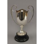 An engraved silver trophy cup on stand. 36 cm high overall. 22.1 troy ounces.