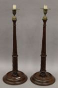 A large pair of Victorian mahogany candlesticks. 53 cm high.