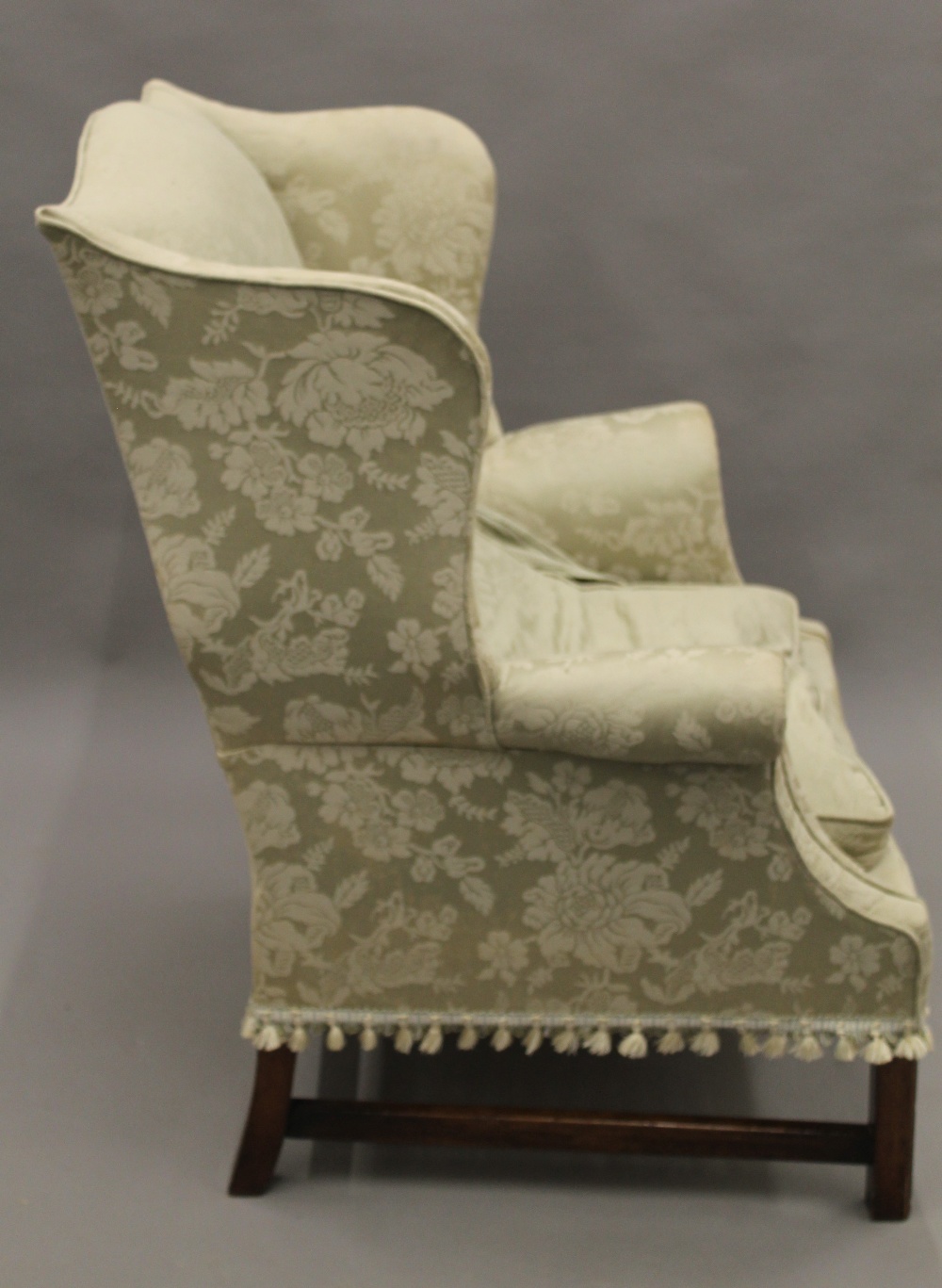 An early 20th century upholstered wing back armchair. 80 cm wide. - Image 3 of 8