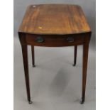 A George III mahogany oval Pembroke table. 81 cm wide.