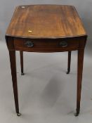 A George III mahogany oval Pembroke table. 81 cm wide.