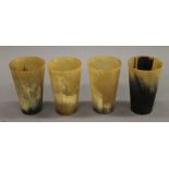 Four horn beakers. Each approximately 11.5 cm high.