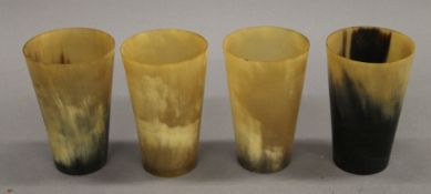 Four horn beakers. Each approximately 11.5 cm high.