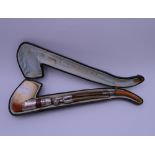 A cased 19th century French unmarked silver mounted Meerschaum pipe. 24 cm long.