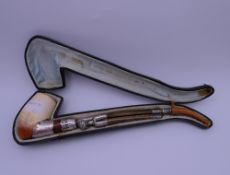 A cased 19th century French unmarked silver mounted Meerschaum pipe. 24 cm long.