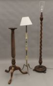 A barley twist standard lamp, another standard lamp and a torchere. The former 180 cm high overall.