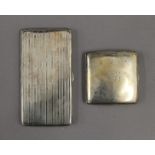 Two silver cigarette cases. The largest 15.5 cm wide. 11.9 troy ounces.