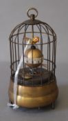 A bird cage clock. 17 cm high.