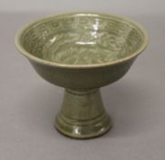 A Chinese green pottery stem cup. 8.5 cm high.