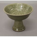 A Chinese green pottery stem cup. 8.5 cm high.