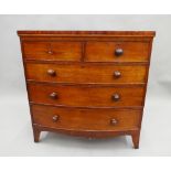 A Victorian mahogany bowfront chest of drawers. 102 cm wide.