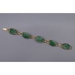 A 14 ct gold and jade bracelet. 16.5 cm long.