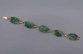 A 14 ct gold and jade bracelet. 16.5 cm long.