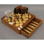 A wooden games compendium. 25.5 cm wide.