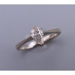 A 14 ct white gold marquise cut diamond ring. Ring size K/L.
