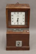 A vintage clocking-in clock. 69 cm high.