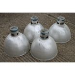 Four large industrial light shades. 48 cm diameter.