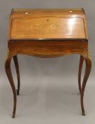 A Victorian inlaid rosewood bonheur du jour. 65.5 cm wide.