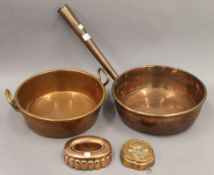 Two copper pans and two copper moulds. The largest pan 32 cm diameter.