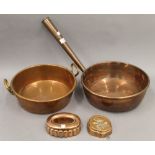 Two copper pans and two copper moulds. The largest pan 32 cm diameter.