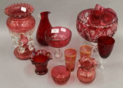 A quantity of various cranberry glass