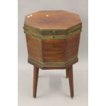 A George III brass bound mahogany octagonal wine cooler. 49 cm wide.