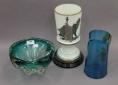 A Victorian glass oil lamp base, a blue glass jug and an art glass vase. The former 28 cm high.