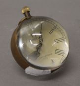 A small ball clock. 7 cm high.