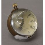 A small ball clock. 7 cm high.