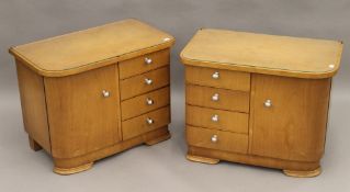 A pair of Art Deco style bedside cupboards. Each 64 cm wide.