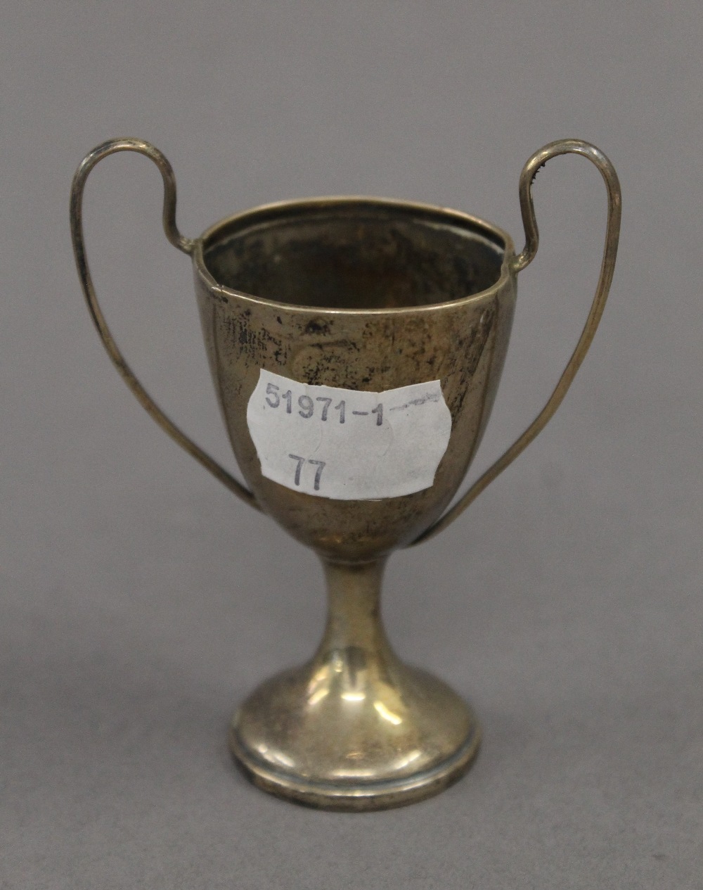 A silver bud vase, a small silver trophy cup and a broken silver trophy cup. The former 22 cm high. - Image 7 of 12