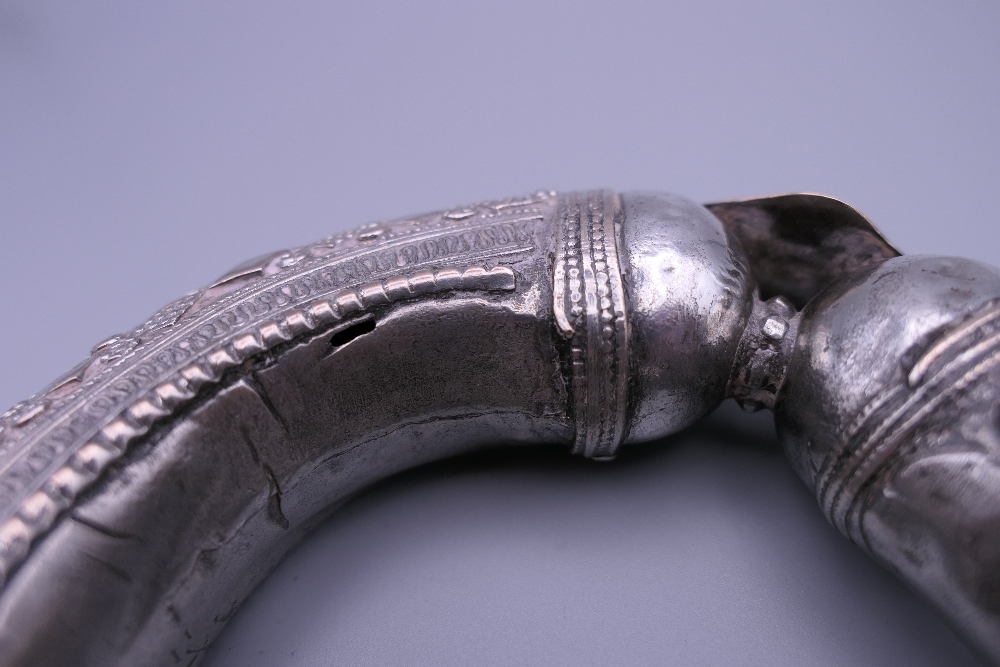 Three Eastern white metal bangles, two probably unmarked silver. The largest 12.5 cm diameter. - Image 13 of 14