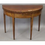 A George III strung and crossbanded mahogany fold over tea table. 99 cm wide.