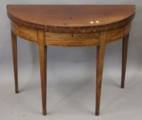 A George III strung and crossbanded mahogany fold over tea table. 99 cm wide.