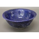 A Chinese blue ground pottery bowl. 15 cm diameter.